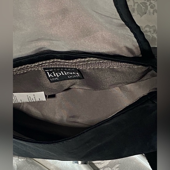 Kipling Sabian Crossbody Mini Bag In Black
Approx. 7.75" W x 5.75" H x 3.25" D - Picture 4 of 7